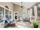 Relaxing sunroom with abundant natural light, comfortable seating, and ceiling fan at 2041 Democracy Dr, Buford, GA 30519