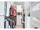 Organized walk-in closet with built-in shelving and ample storage for clothing at 2041 Democracy Dr, Buford, GA 30519