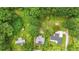 Aerial view of a property with lush greenery and a cozy outdoor dining set at 232 S Candler St, Villa Rica, GA 30180