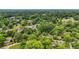 An aerial view of a neighborhood nestled in a lush forest landscape at 232 S Candler St, Villa Rica, GA 30180