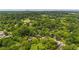 Lovely aerial view of the residence situated among dense trees in a suburban setting at 232 S Candler St, Villa Rica, GA 30180