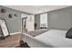 Bedroom featuring gray paneled walls and wood-look vinyl flooring at 232 S Candler St, Villa Rica, GA 30180