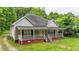 Lovely single-story house with a covered front porch and a stone pathway at 232 S Candler St, Villa Rica, GA 30180