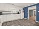 Bright kitchen featuring white cabinets, stainless appliances, and tile flooring at 232 S Candler St, Villa Rica, GA 30180