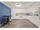 Bright kitchen with white cabinets, modern appliances, and tile backsplash at 232 S Candler St, Villa Rica, GA 30180