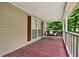 Cozy porch with a wooden swing, perfect for relaxing and enjoying the outdoors at 232 S Candler St, Villa Rica, GA 30180