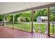 Inviting front porch overlooking the neighborhood with wood flooring and open railing at 232 S Candler St, Villa Rica, GA 30180