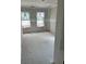 Another bedroom under construction, featuring two bright windows for natural light at 27 Benscot Dr, Austell, GA 30106