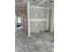 Unfinished living room featuring a framed wall and an open doorway to another room at 27 Benscot Dr, Austell, GA 30106