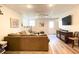 Finished basement with a comfortable seating area and a mounted tv at 310 Hillpine Dr, Woodstock, GA 30189