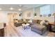 Finished basement with a comfortable seating area and an adjacent area for recreation at 310 Hillpine Dr, Woodstock, GA 30189