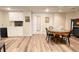 The finished basement includes a wet bar, light wood floors and recessed lighting at 310 Hillpine Dr, Woodstock, GA 30189