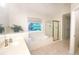Bathroom showcasing a garden tub and shower with natural lighting at 310 Hillpine Dr, Woodstock, GA 30189
