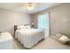 Inviting bedroom with cozy decor, soft lighting, and charming accents creating a relaxing atmosphere at 310 Hillpine Dr, Woodstock, GA 30189