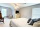 Bedroom featuring a dresser, a bedside table and TV with a ceiling fan at 310 Hillpine Dr, Woodstock, GA 30189