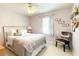 Bedroom with a decorative pillow on the bed, with light purple walls and décor at 310 Hillpine Dr, Woodstock, GA 30189