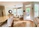Bright breakfast nook with hardwood floors, outdoor views, and stylish decor at 310 Hillpine Dr, Woodstock, GA 30189