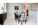 Cozy dining room with a rustic blue table and stylish chairs, perfect for Gathering gatherings at 310 Hillpine Dr, Woodstock, GA 30189