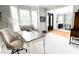 Bright and airy office space with white walls, a stylish desk, and neutral-toned furniture, enhancing productivity at 310 Hillpine Dr, Woodstock, GA 30189