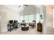 Bright office space with vaulted ceilings, a modern desk, and comfortable seating area bathed in natural light at 310 Hillpine Dr, Woodstock, GA 30189