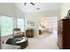 Charming sitting area leads to a serene bedroom with a comfortable bed and soft, inviting linens at 310 Hillpine Dr, Woodstock, GA 30189