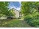 Spacious backyard featuring lush greenery, perfect for outdoor activities and relaxation at 3870 Michaels Creek Ct, Loganville, GA 30052