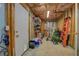 Unfinished basement featuring exposed beams, shelving, and storage at 3870 Michaels Creek Ct, Loganville, GA 30052