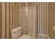 Bathroom features patterned wallpaper and stand up shower at 3870 Michaels Creek Ct, Loganville, GA 30052