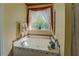 Cozy bathtub with bright window, decorative accents, and a soothing ambiance at 3870 Michaels Creek Ct, Loganville, GA 30052