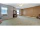 Spacious bedroom featuring neutral carpet, ceiling fan and large windows at 3870 Michaels Creek Ct, Loganville, GA 30052