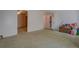 Large bedroom area with multiple access doors and neutral carpeting at 3870 Michaels Creek Ct, Loganville, GA 30052