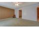 Bedroom with neutral carpet, fan and access to ensuite bathroom at 3870 Michaels Creek Ct, Loganville, GA 30052