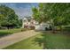 Charming two-story home with a well-manicured lawn and a pop of color from the red front door at 3870 Michaels Creek Ct, Loganville, GA 30052