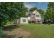 Charming two-story home with a well-manicured lawn and a pop of color from the red front door at 3870 Michaels Creek Ct, Loganville, GA 30052
