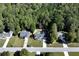 Scenic aerial view of a neighborhood featuring single-story homes, well-manicured lawns and lush greenery at 540 Windermere Dr, Loganville, GA 30052