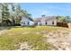 Large backyard with a patio and fire pit area, perfect for gatherings and outdoor fun at 540 Windermere Dr, Loganville, GA 30052