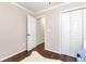 Cozy bedroom with hardwood flooring, closet with double doors, and freshly painted walls at 540 Windermere Dr, Loganville, GA 30052