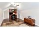 Cozy bedroom with a built-in desk, ceiling fan, and beautiful wood floors at 540 Windermere Dr, Loganville, GA 30052