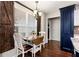 Eat-in kitchen area with breakfast table and views of the outside through window with wooden shutters at 540 Windermere Dr, Loganville, GA 30052