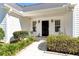 Cozy front porch featuring rocking chairs, potted plants, and a welcoming entrance at 540 Windermere Dr, Loganville, GA 30052