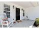 Inviting front porch with rocking chairs and seasonal decor, creating a warm and welcoming entrance at 540 Windermere Dr, Loganville, GA 30052