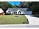 Beautiful one-story home with a well-maintained lawn and an inviting front exterior on a sunny day at 540 Windermere Dr, Loganville, GA 30052