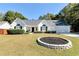 Charming single-story home with a well-manicured lawn and inviting curb appeal on a sunny day at 540 Windermere Dr, Loganville, GA 30052