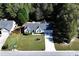 Charming single-story home featuring well-manicured lawn, dark roof, and a neatly maintained landscaped yard at 540 Windermere Dr, Loganville, GA 30052