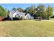 A charming single-story home with an expansive, well-manicured lawn creating a welcoming exterior at 540 Windermere Dr, Loganville, GA 30052