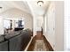Hallway leading to the living room, dining room, and entry door, with wood floors at 540 Windermere Dr, Loganville, GA 30052