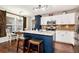 Kitchen featuring white cabinets, granite countertops, and stainless steel appliances at 540 Windermere Dr, Loganville, GA 30052