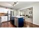 Open kitchen with stainless steel appliances and a view into the cozy living room at 540 Windermere Dr, Loganville, GA 30052