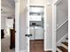 Bright laundry room with white washer and dryer, storage cabinets and folding shelf at 540 Windermere Dr, Loganville, GA 30052