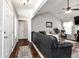 Spacious living room with high ceilings, hardwood floors, a ceiling fan, and comfortable leather seating at 540 Windermere Dr, Loganville, GA 30052